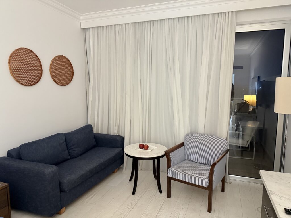 Sofa in corner of room Grecian Sands Hotel
