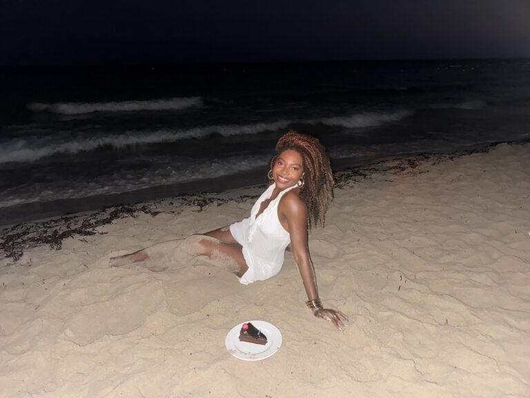 things I would tell my younger self - Metiya on the beach with cake